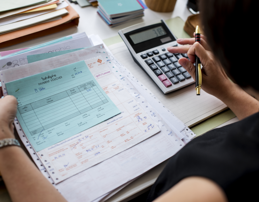 asian-woman-working-through-paperwork